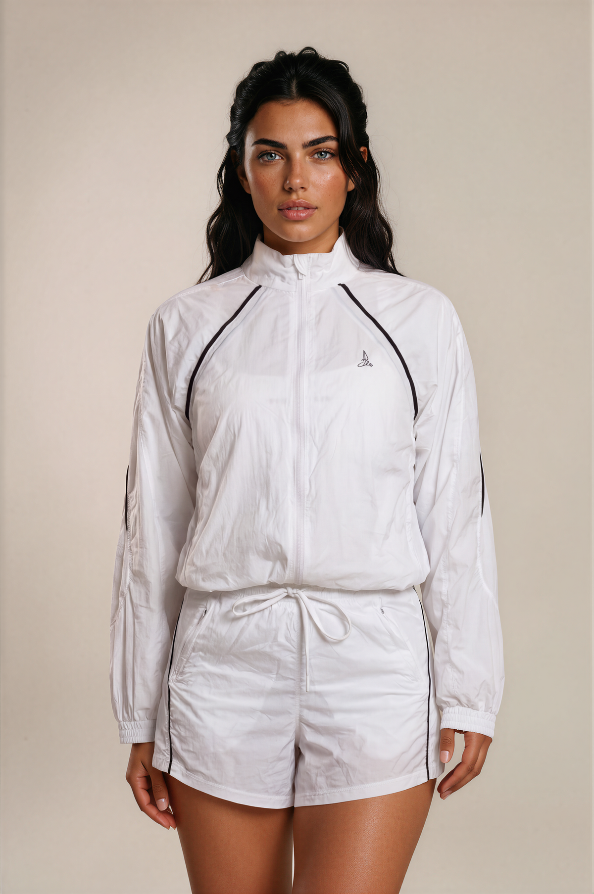 Front view of women’s Aero Court Set in white with black piping and drawstring shorts